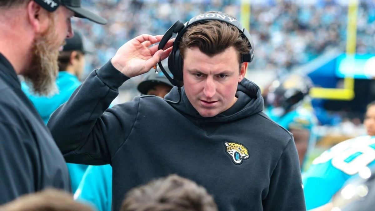 “Grant Udinski during a Jacksonville Jaguars press conference, considering Buffalo Bills head coaching role”