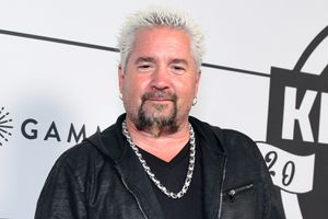 Guy Fieri new hair style on his 58th birthday, showing darker, neatly parted hair instead of his signature spiky blond look
