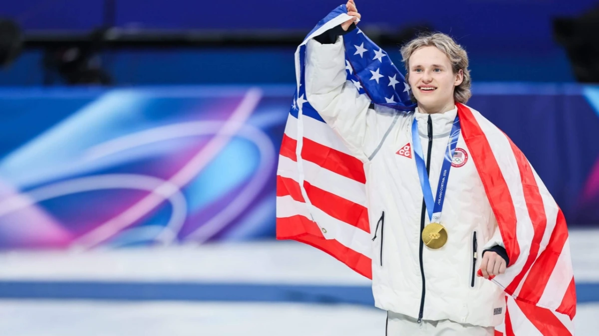 Ilia Malinin performs a quadruple axel during the men’s singles short program at the 2026 Winter Olympics in Milan, leading Team USA.