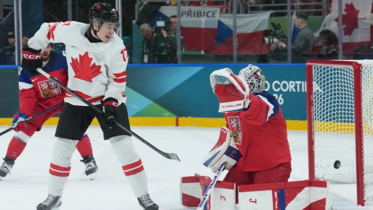 Macklin Celebrini #17 of Team Canada scores a goal against Switzerland at the Milano Cortina 2026 Winter Olympics.