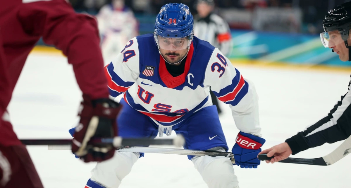Auston Matthews celebrates a goal as Team USA dominates Team Germany 5-1 in Santagiulia Arena, securing first place in Group C.