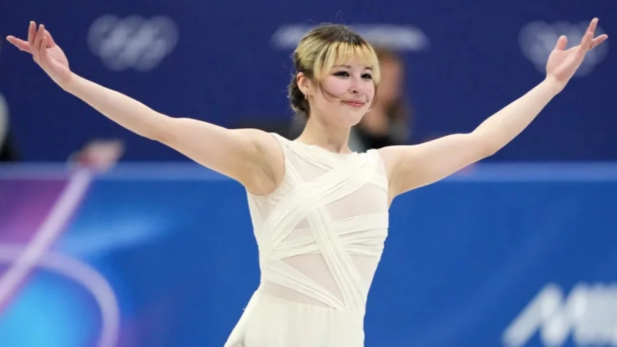 “Alysa Liu performing a jump during a figure skating competition after returning from retirement, 2025 World Championships.”