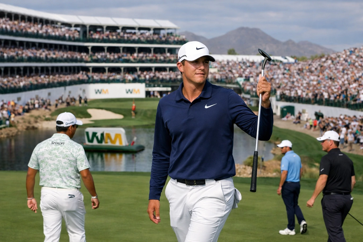 Michael Thorbjornsen holding putter at TPC Scottsdale during the 2026 WM Phoenix Open, with fans cheering in the background.