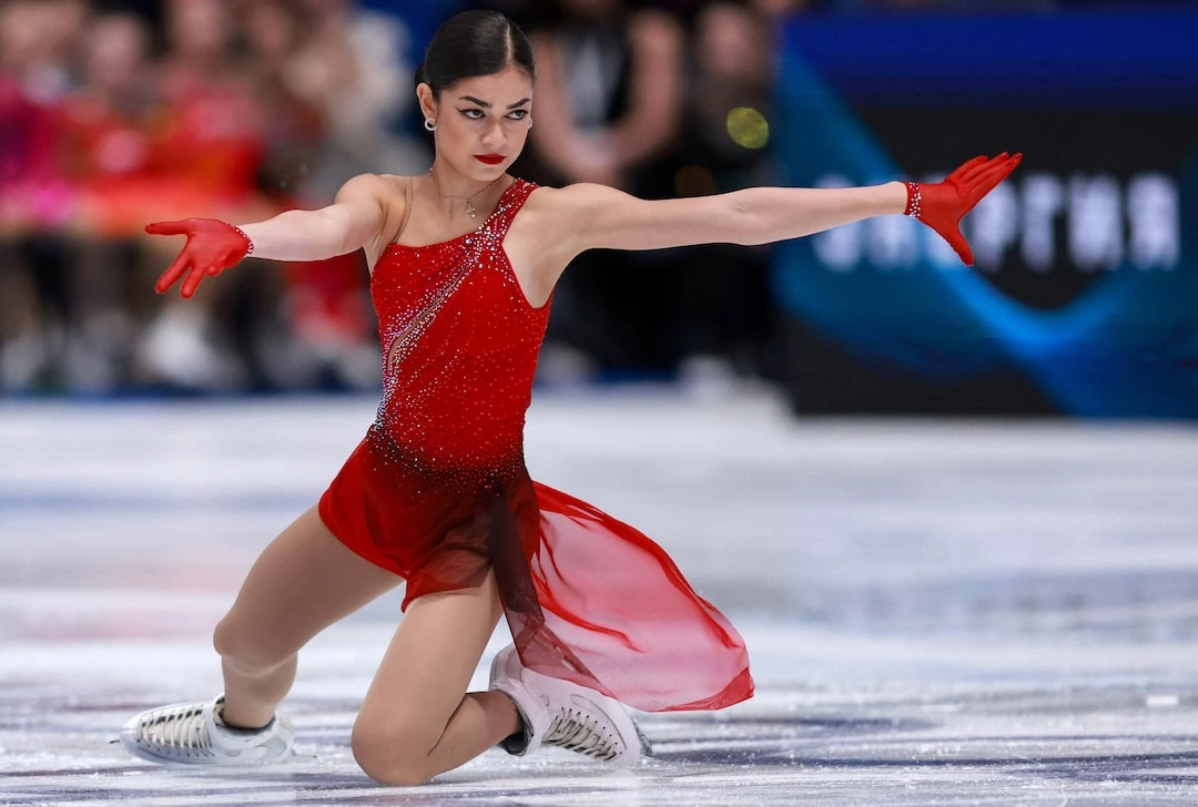 Adeliia Petrosian performs a triple jump during her Olympic short program at the 2026 Winter Games in Milan.