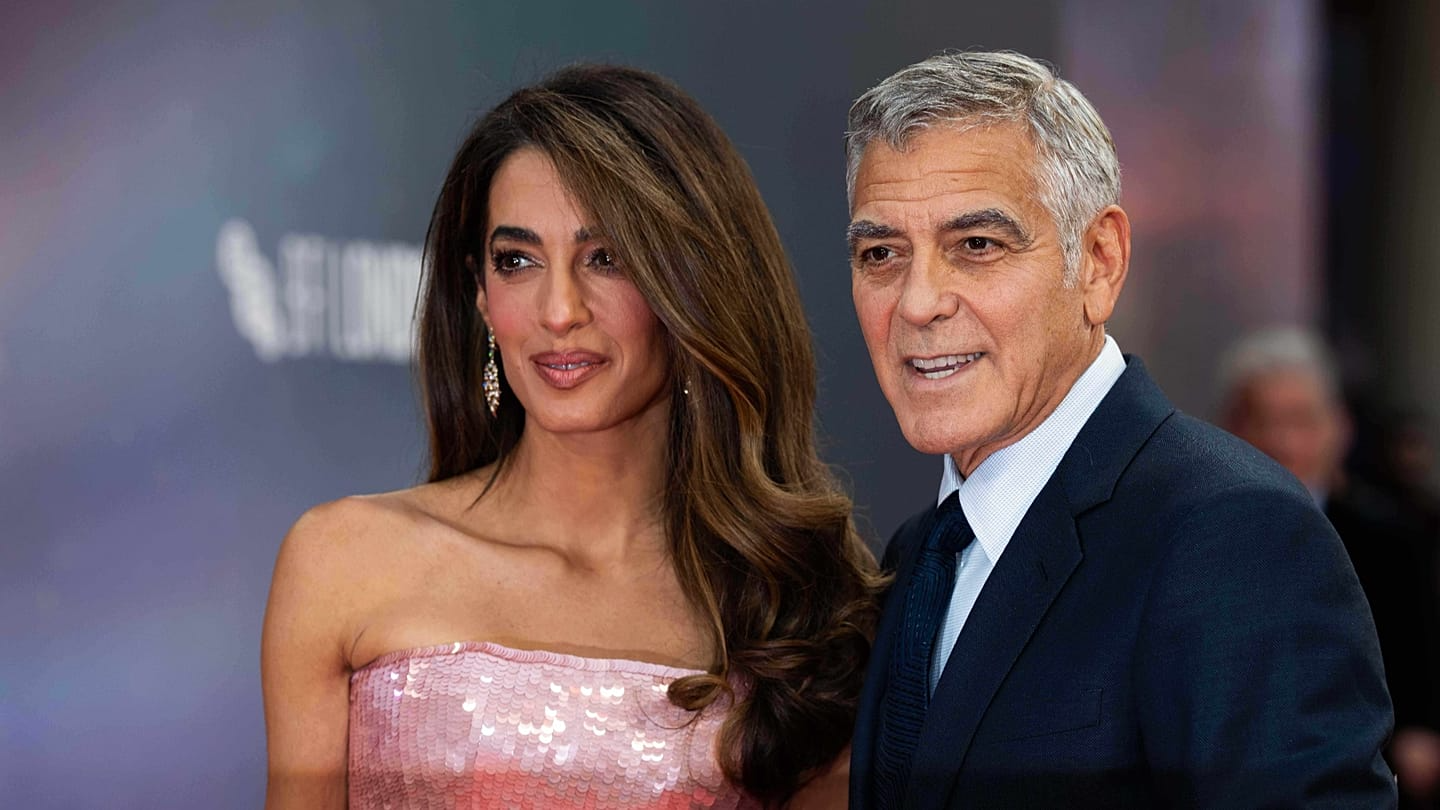George and Amal Clooney with their twins Ella and Alexander at a rare charity dinner in Lake Como, Italy.