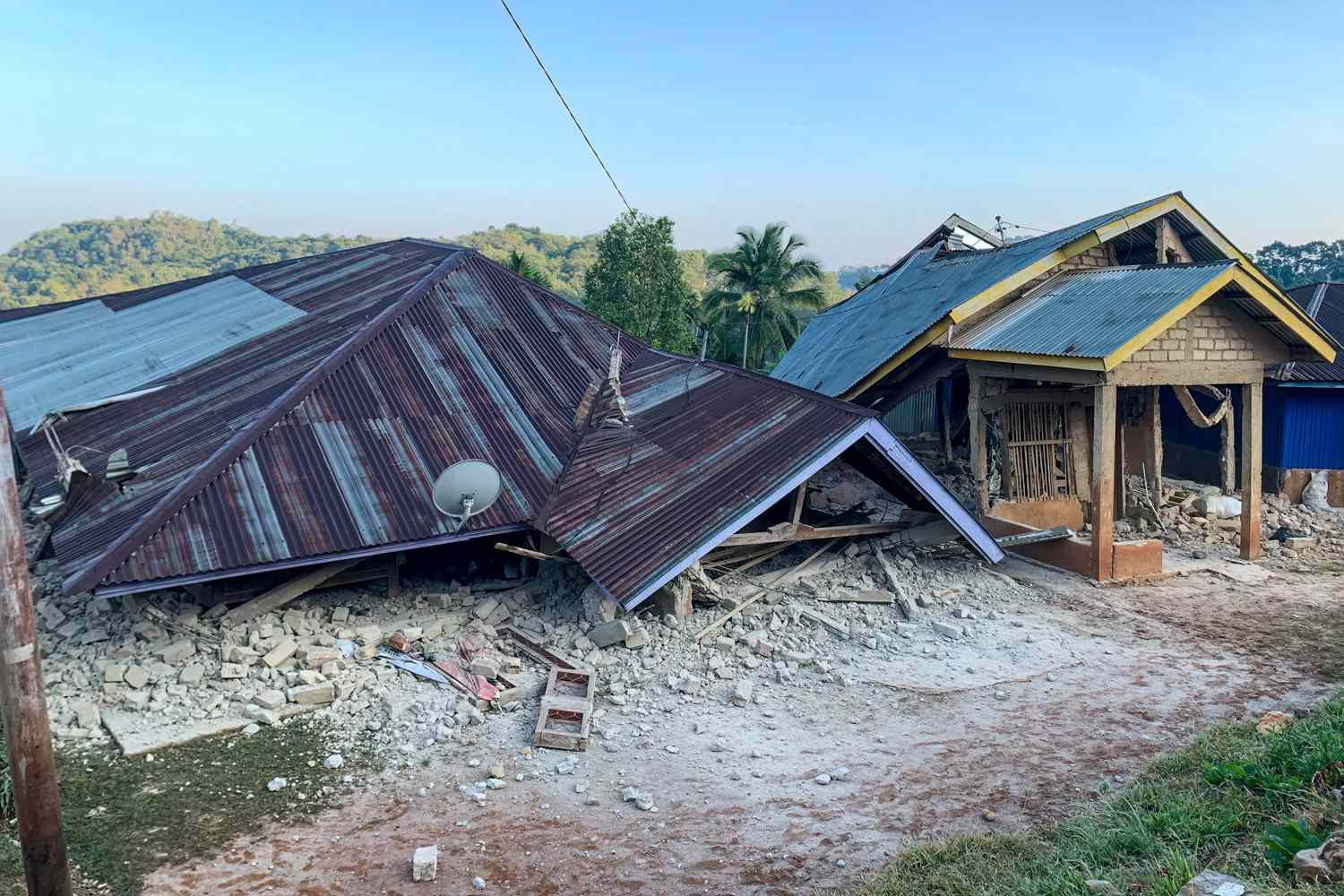 Damaged houses in Flores, Indonesia, following a powerful 7.7-magnitude earthquake on August 15, 2026.