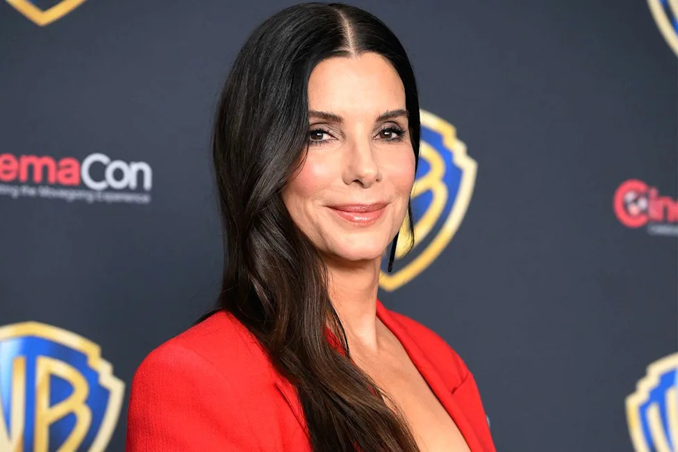 Sandra Bullock enjoying outdoor activities with family and friends, including nature walks, fishing and rafting, in a rare glimpse of her family life.