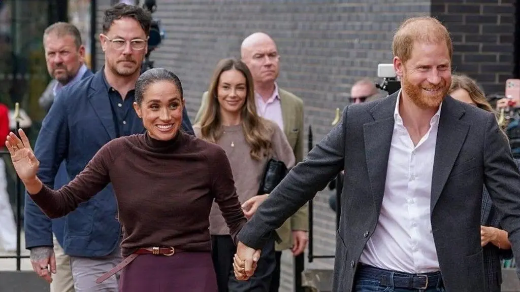 Meghan Markle and Prince Harry receive a warm welcome during their joint charity visit to Nottingham, UK.